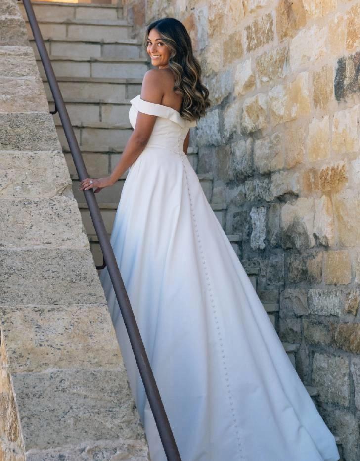 Model wearing a white wedding dress