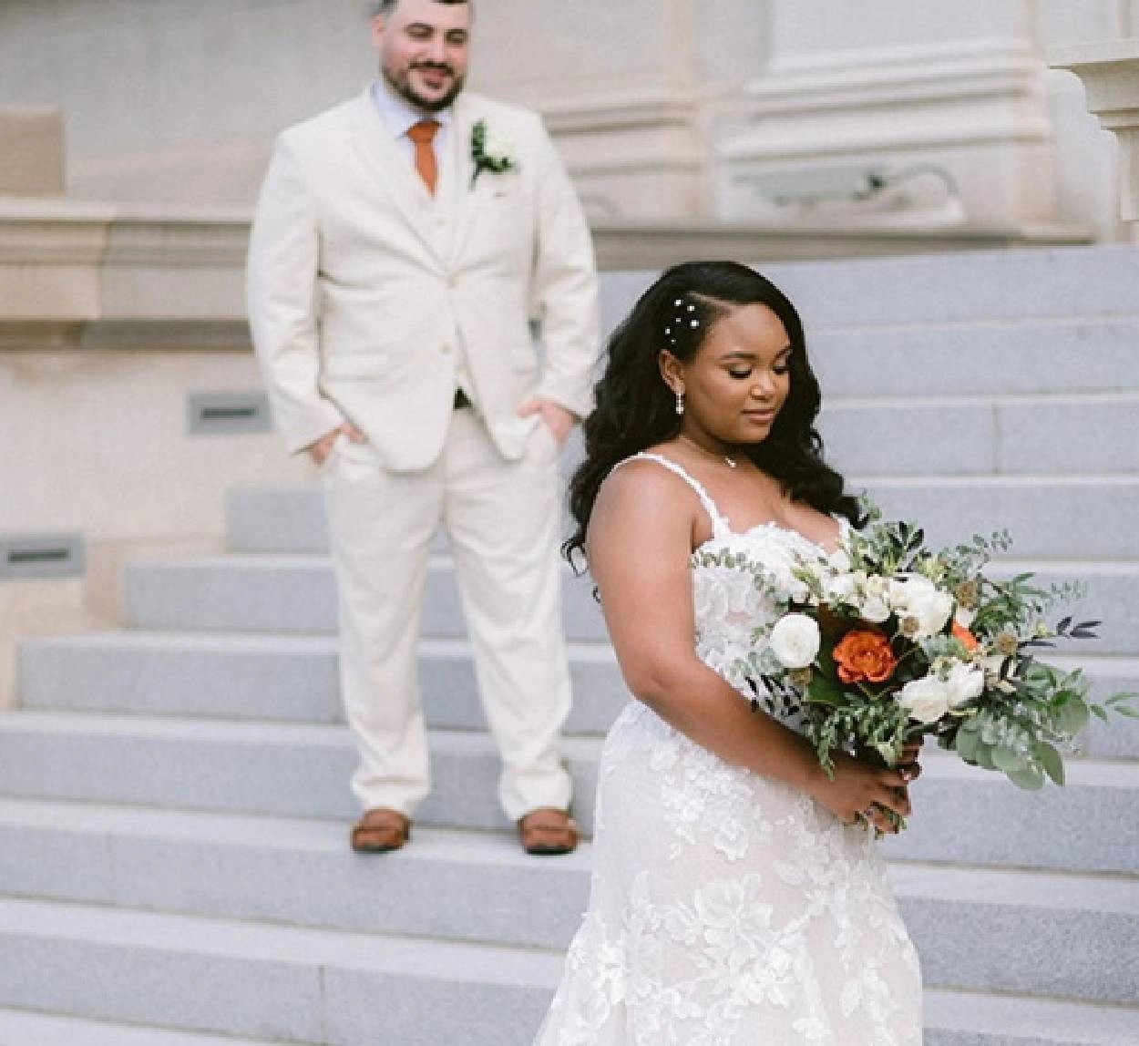 Plus size model wearing a white wedding dress