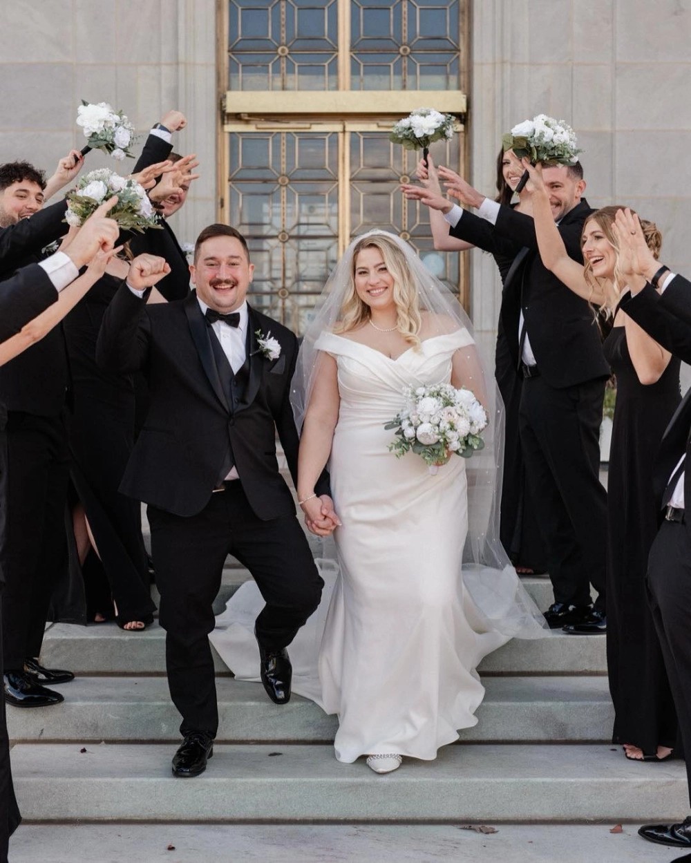Plus size model wearing a white wedding dress