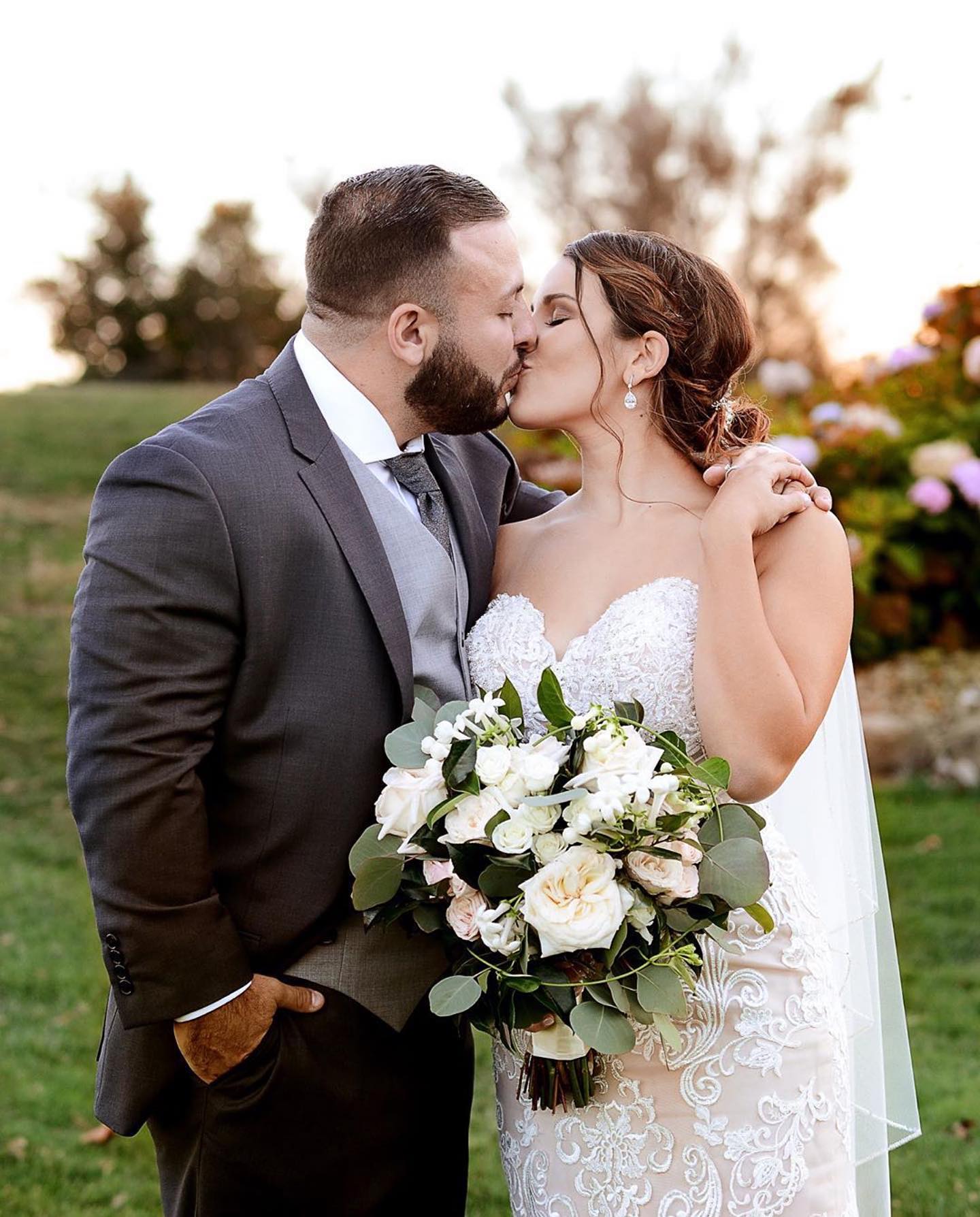 Photo of a real bride and groom kissing
