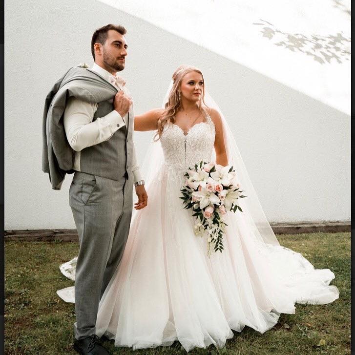 Photo of a bride and groom standing